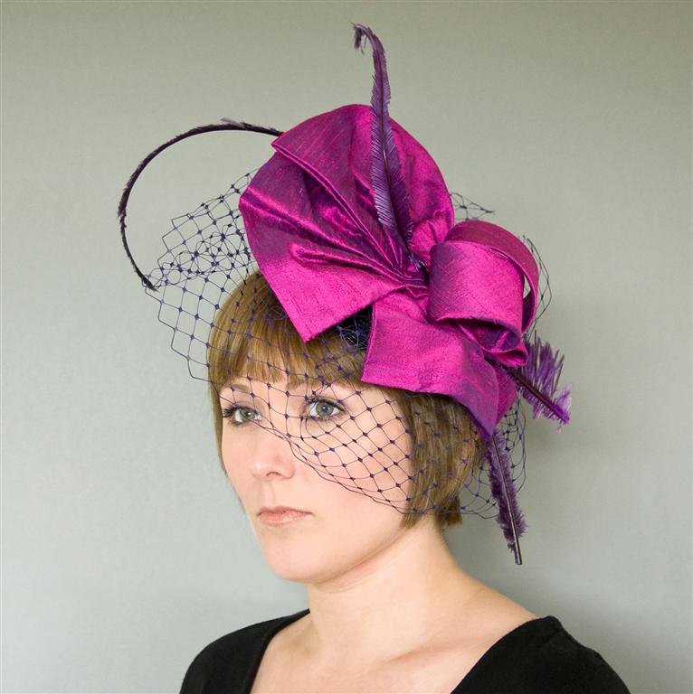 Joy is a handcrafted headpiece of rosebud dupion silk with trimmed down 