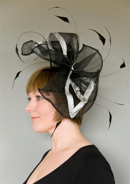 headpiece with sinamay rolled edges and coquefeathers